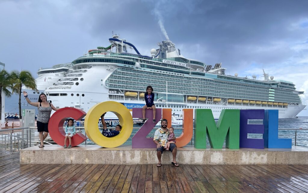 palagars taking picture on the cozumel sign
