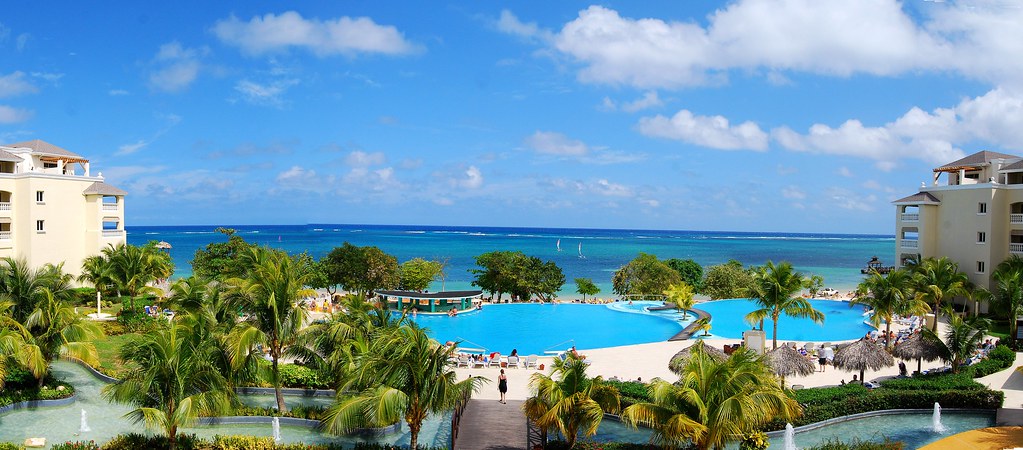 Iberostar Rose Hall resort in Falmouth, Jamaica with beachfront pool, palm trees, and luxury accommodations.