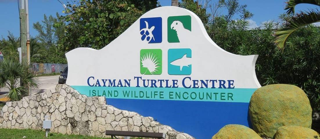 Cayman Turtle Centre entrance sign welcoming visitors to the turtle and marine wildlife park in Grand Cayman.